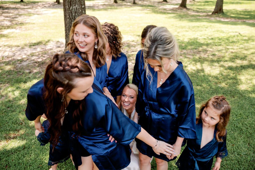 Bridesmaids blocking view of bride from the groom at an Alabama wedding.