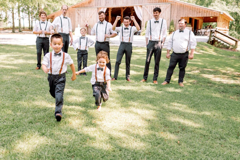 Group of groomsmen sharing laughs and relaxing together before an Alabama wedding ceremony.