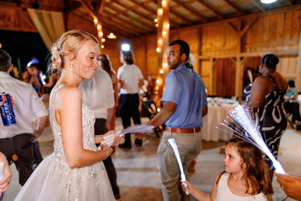 Documentary photography of fun wedding reception at an Alabama wedding venue.